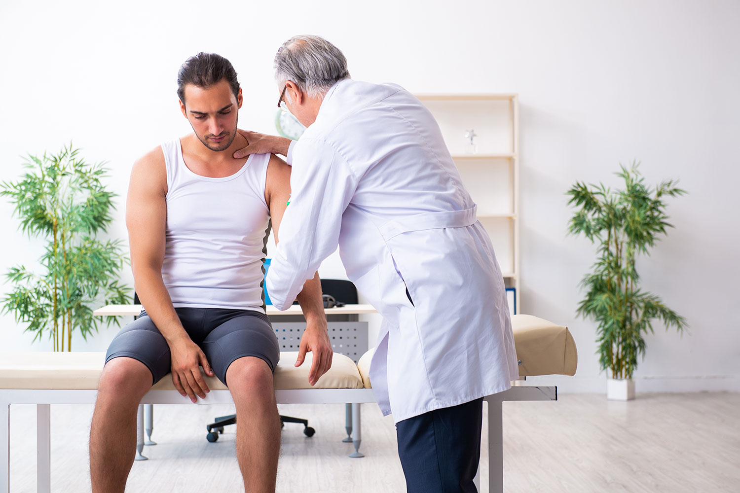 A doctor providing shoulder dislocation treatment